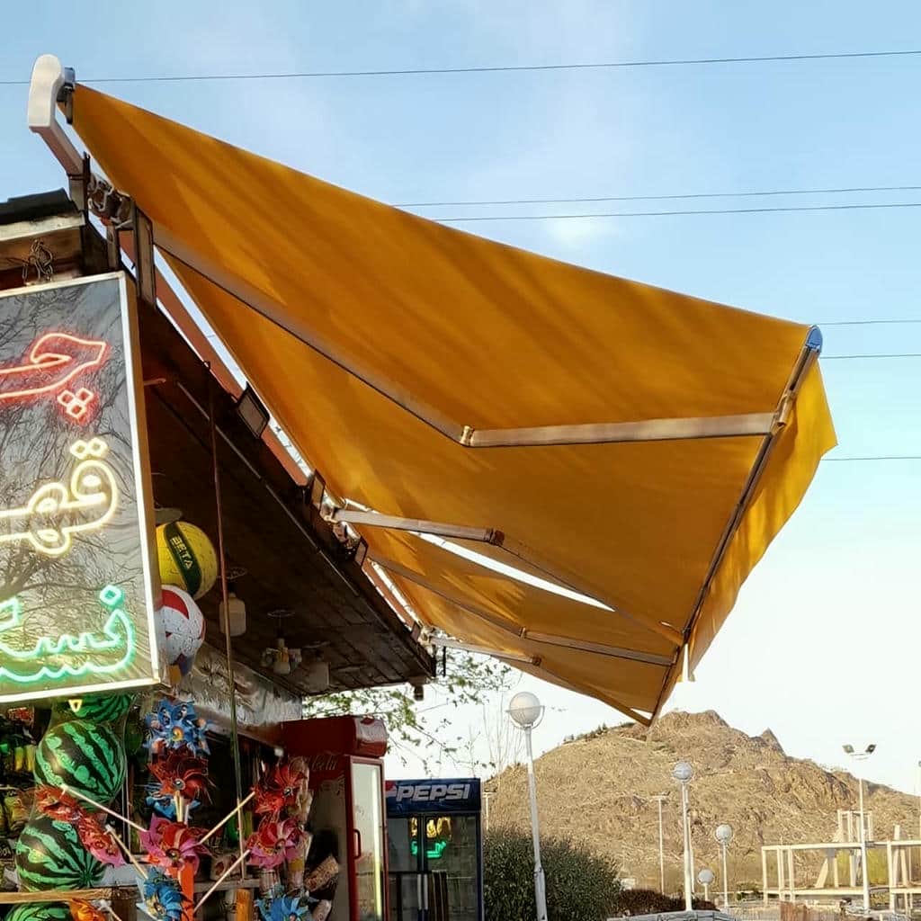 سایبان بازویی بندر عباس با پوشش هماهنگ ساختمان