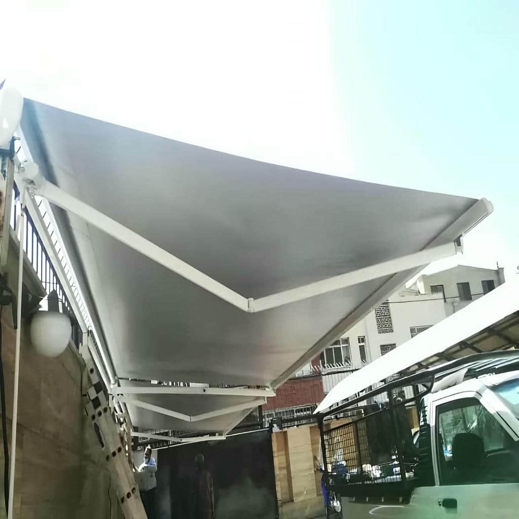 سایبان حیاط برقی بندر عباس با پارچه مقاوم